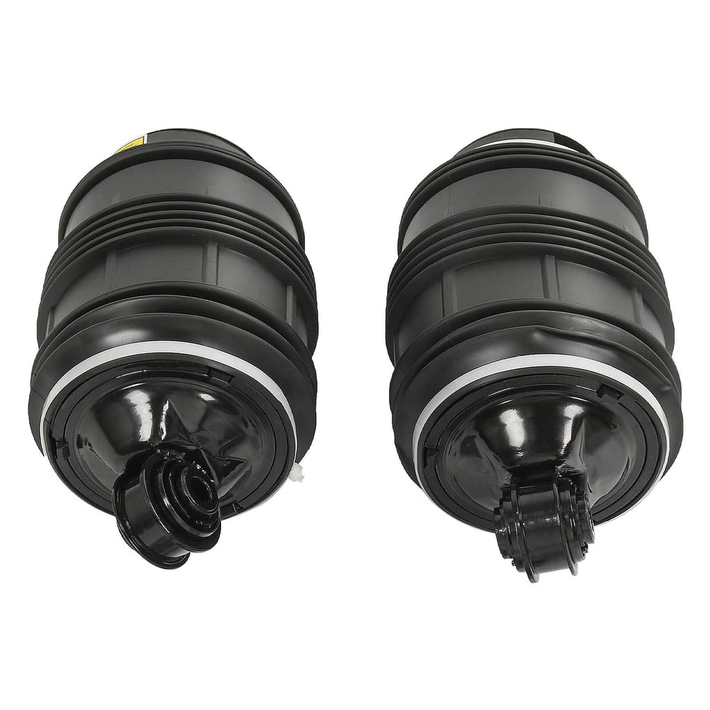 Pair of black rear air suspension springs, close view of top and base ports.