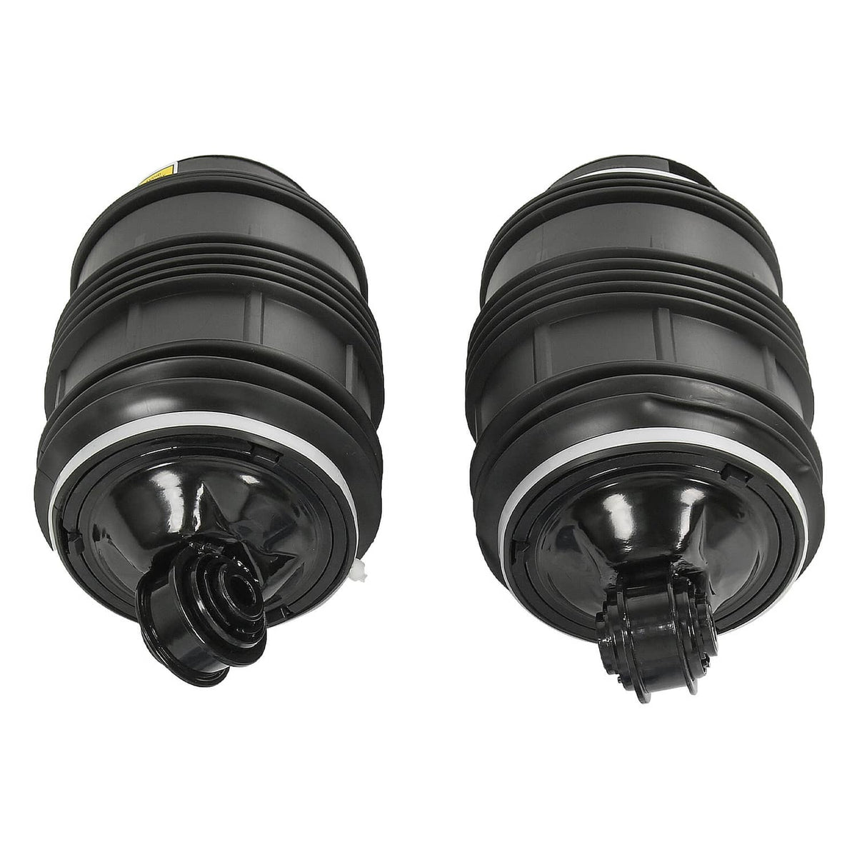 Pair of black rear air suspension springs, close view of top and base ports.