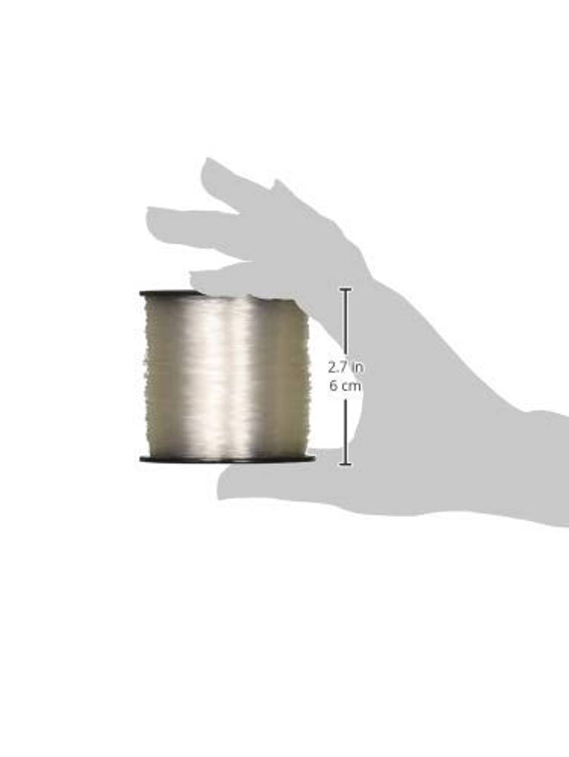 Clear fluorocarbon fishing line spool with 2.7 in height measurement and line on reel.