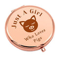 Rose-gold compact makeup mirror with pig graphic and hinged cover