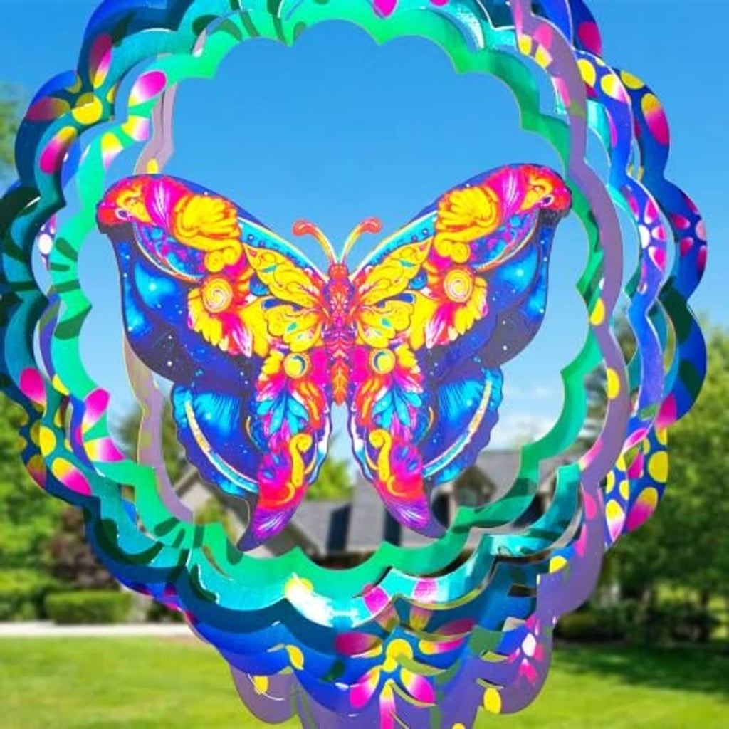 Close-up butterfly metal wind spinner with vivid multicolor wings and glowing teal accents