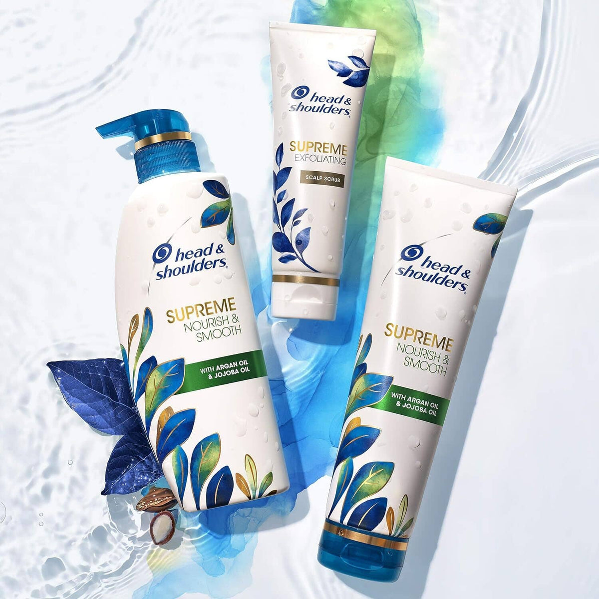 Three head & shoulders Supreme bottles and tubes with blue floral accents