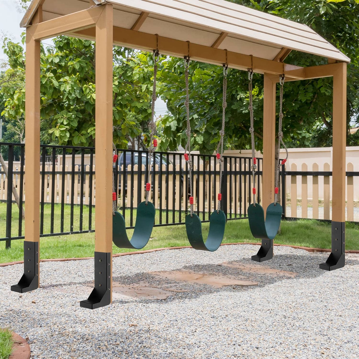 Fence post anchor repair stakes installed under a patio, black steel base supports