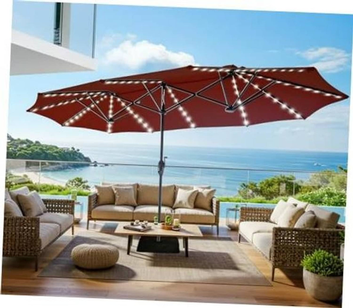 Burgundy patio umbrella canopy with warm solar string lights and central pole.