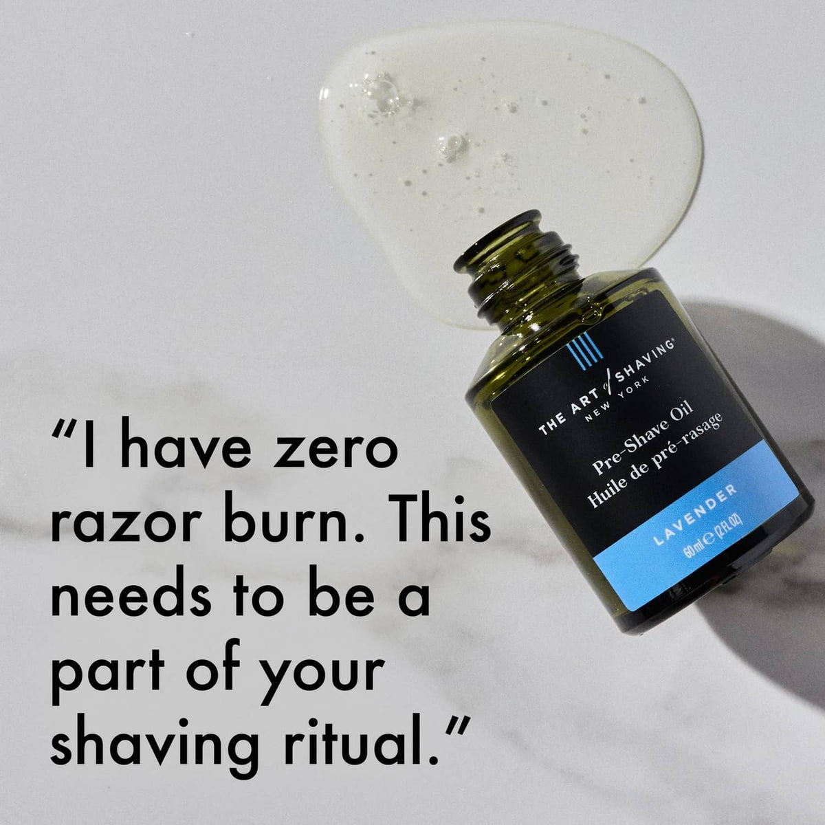 Lavender pre-shave oil bottle with clear oil drop, The Art of Shaving.