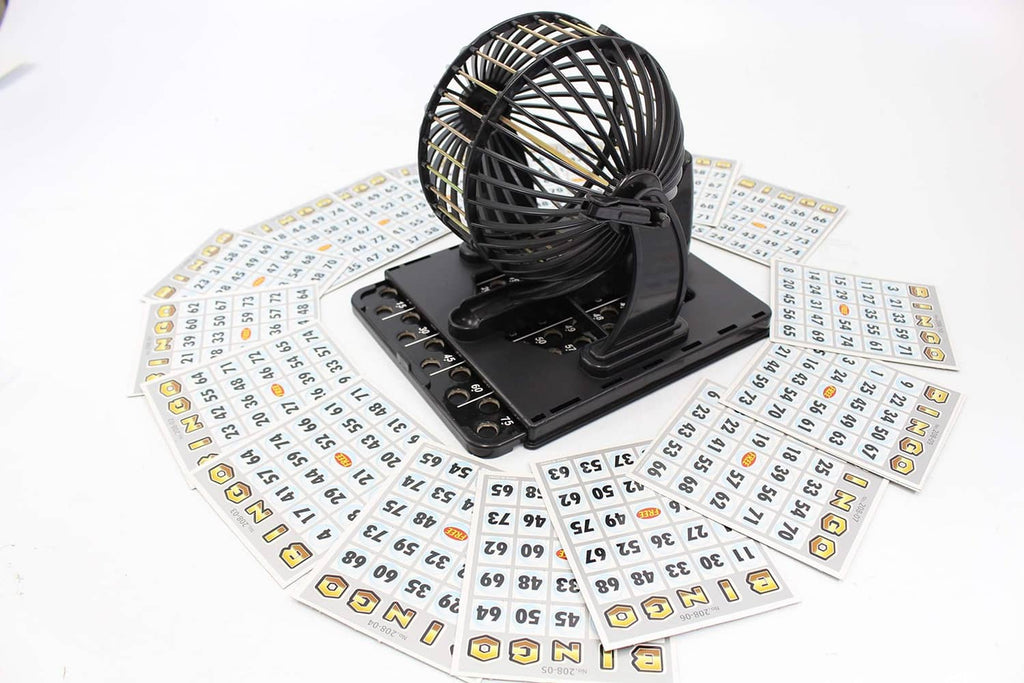Bingo cage game machine centered among white numbered cards