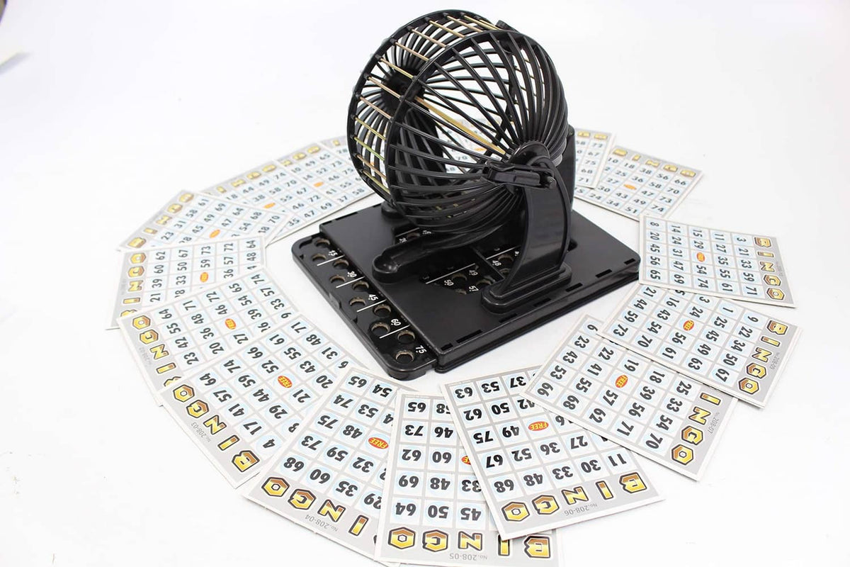 Bingo cage game machine centered among white numbered cards