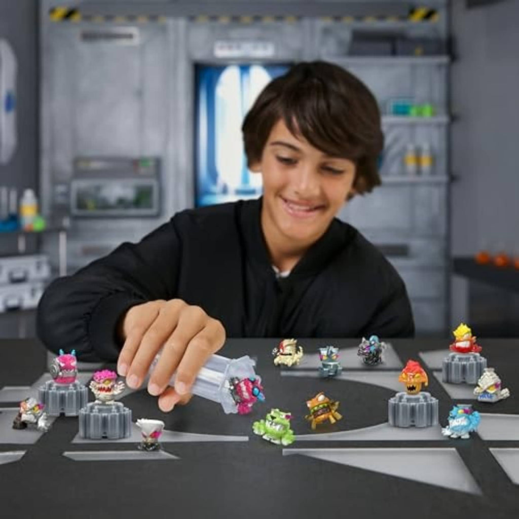 Boy arranging small collectible micro-beast figures on a tabletop