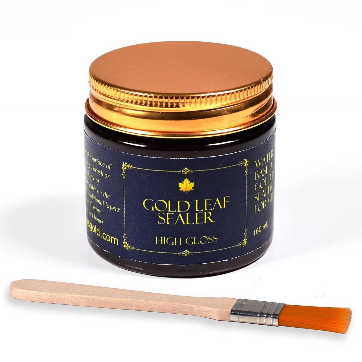 Gold leaf sealer jar with gold-toned lid, labeled, plus orange flat brush