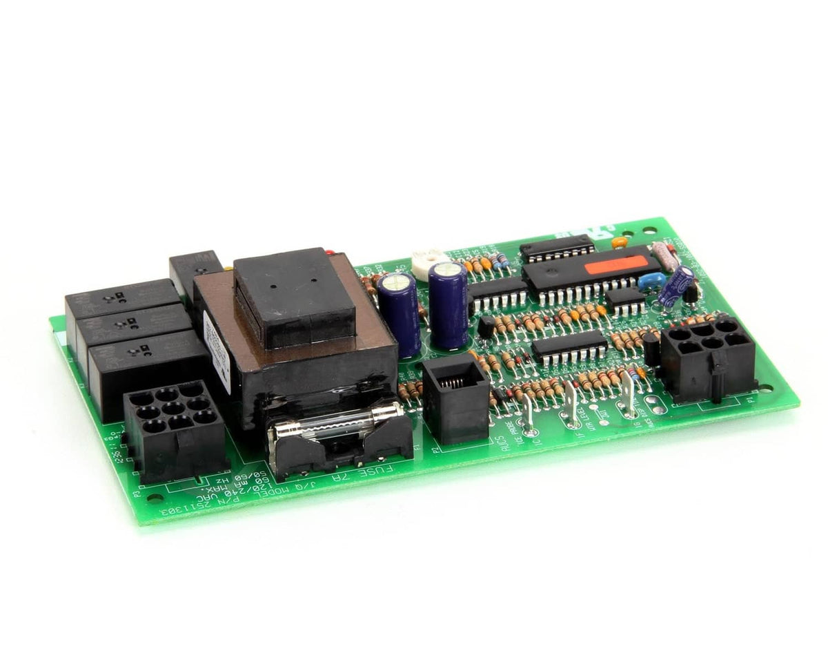 Green PCB control board with black connectors, chips, and cylindrical capacitors