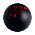 Black 6-speed manual shift knob with red gear pattern 1–6 and R markings