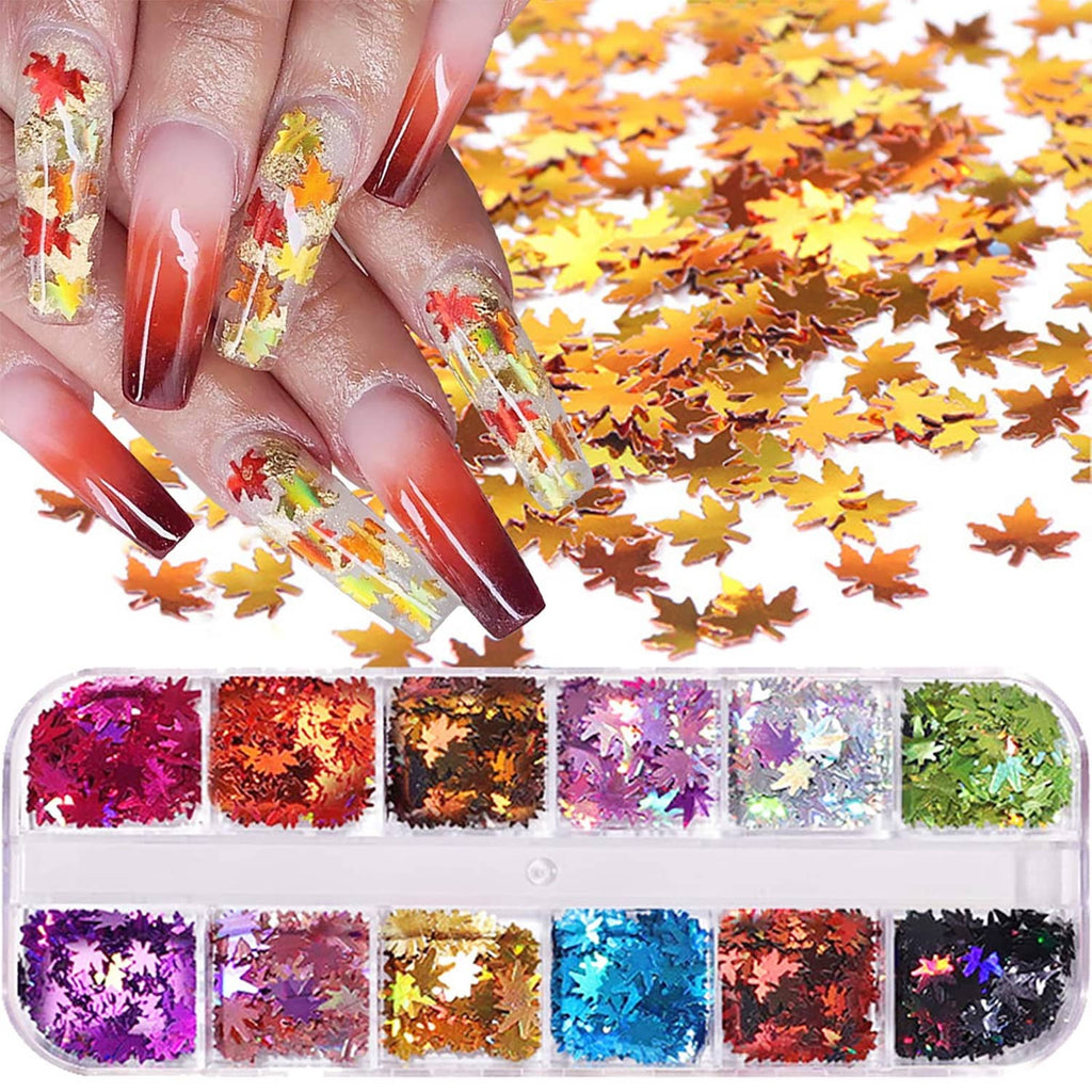 Maple leaf nail glitter sequins on clear nails with red and orange fall leaf shapes
