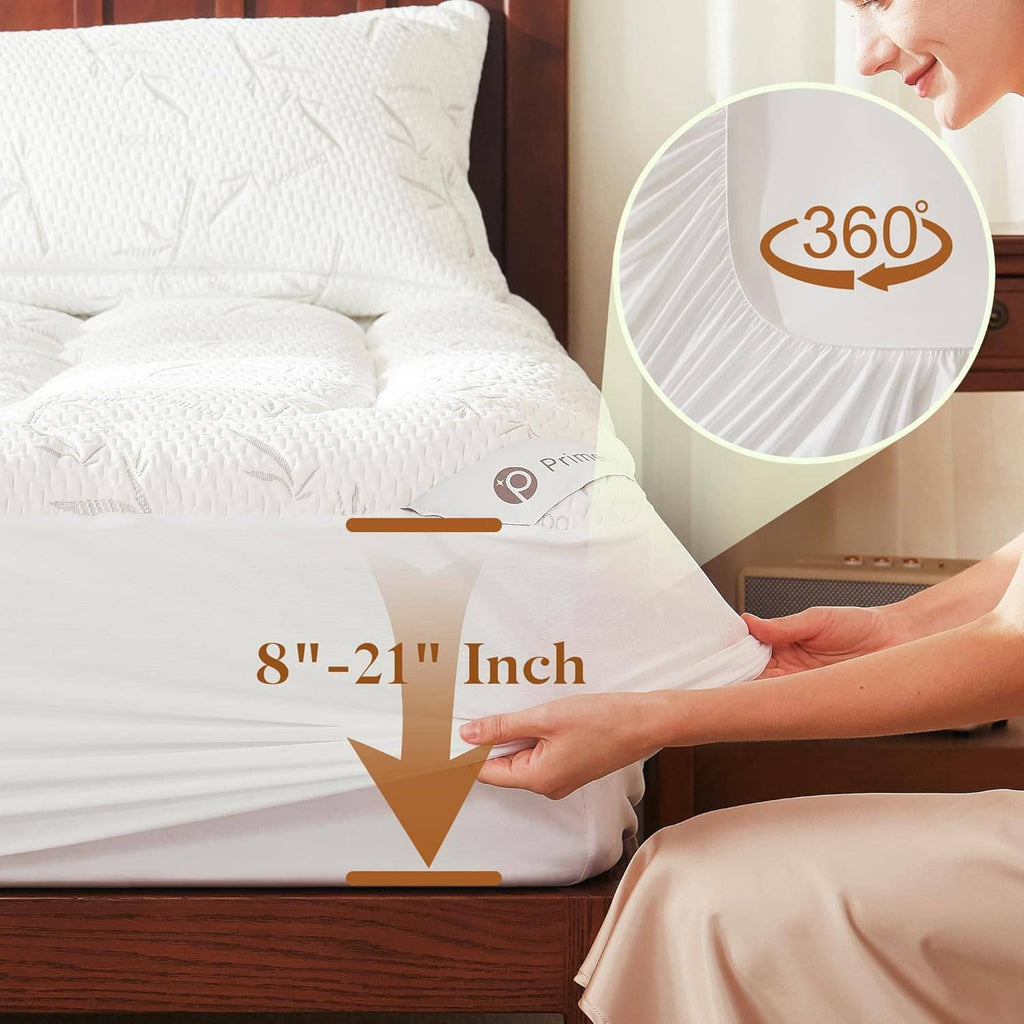 White quilted mattress topper with elastic edges on bed base
