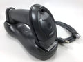 Wireless barcode scanner in charging cradle with attached cable