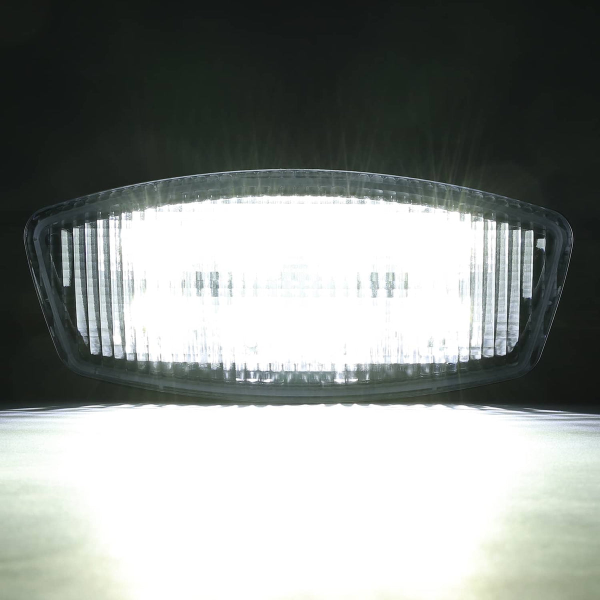 Lit LED cab roof marker light with clear oval lens and dense LED array