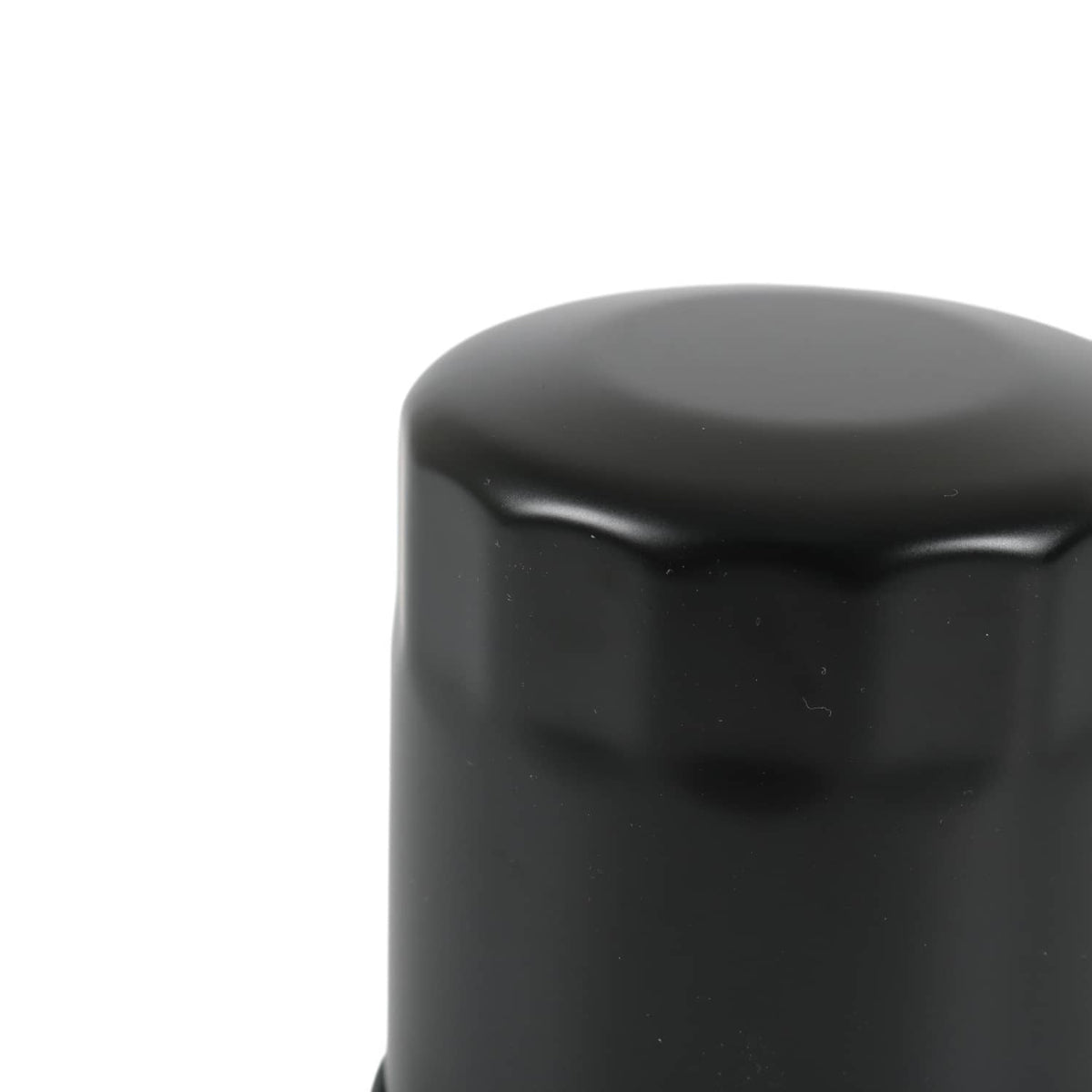 Hydraulic oil filter close-up of black housing top and side contour
