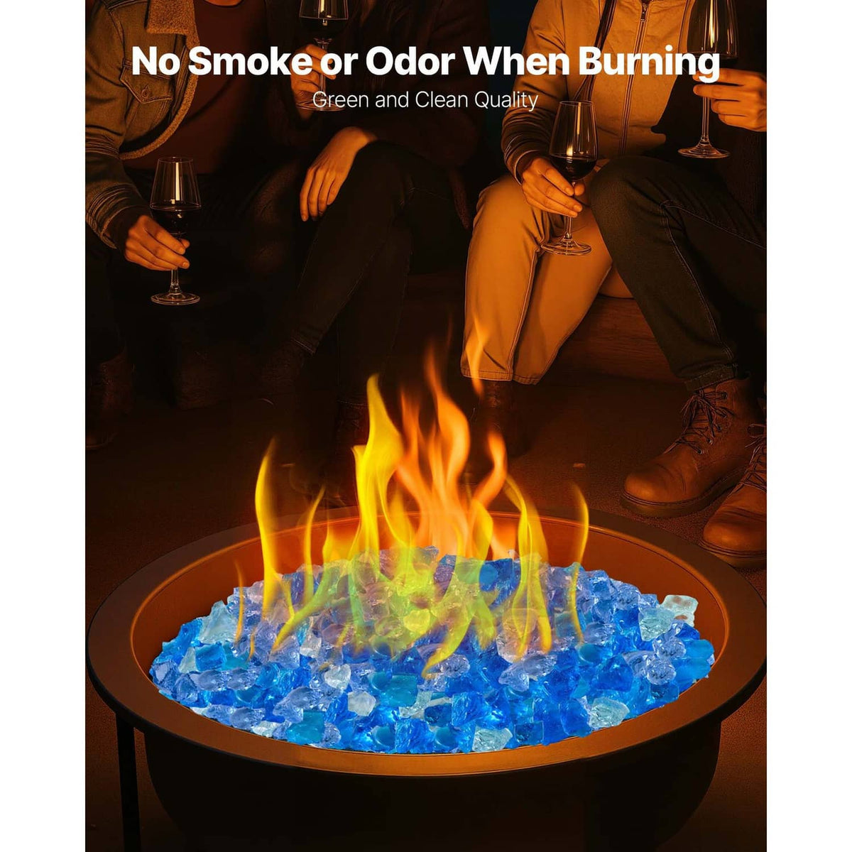 Blue fire pit glass rocks with flames in an outdoor fire bowl