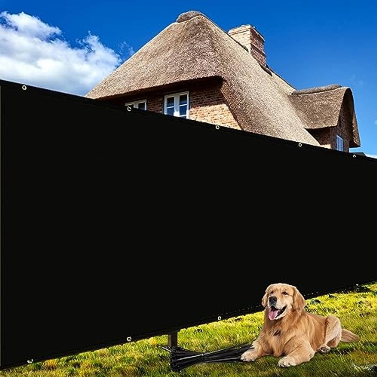 Black fence privacy screen stretched across fence with metal grommets outdoors.