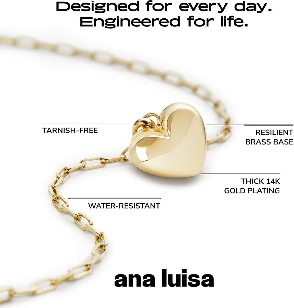 Gold heart pendant necklace with thick paperclip chain and domed heart charm, close view
