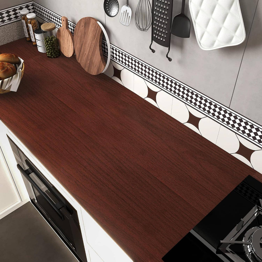 Red-brown cherry wood contact paper on kitchen counter surface, woodgrain plank