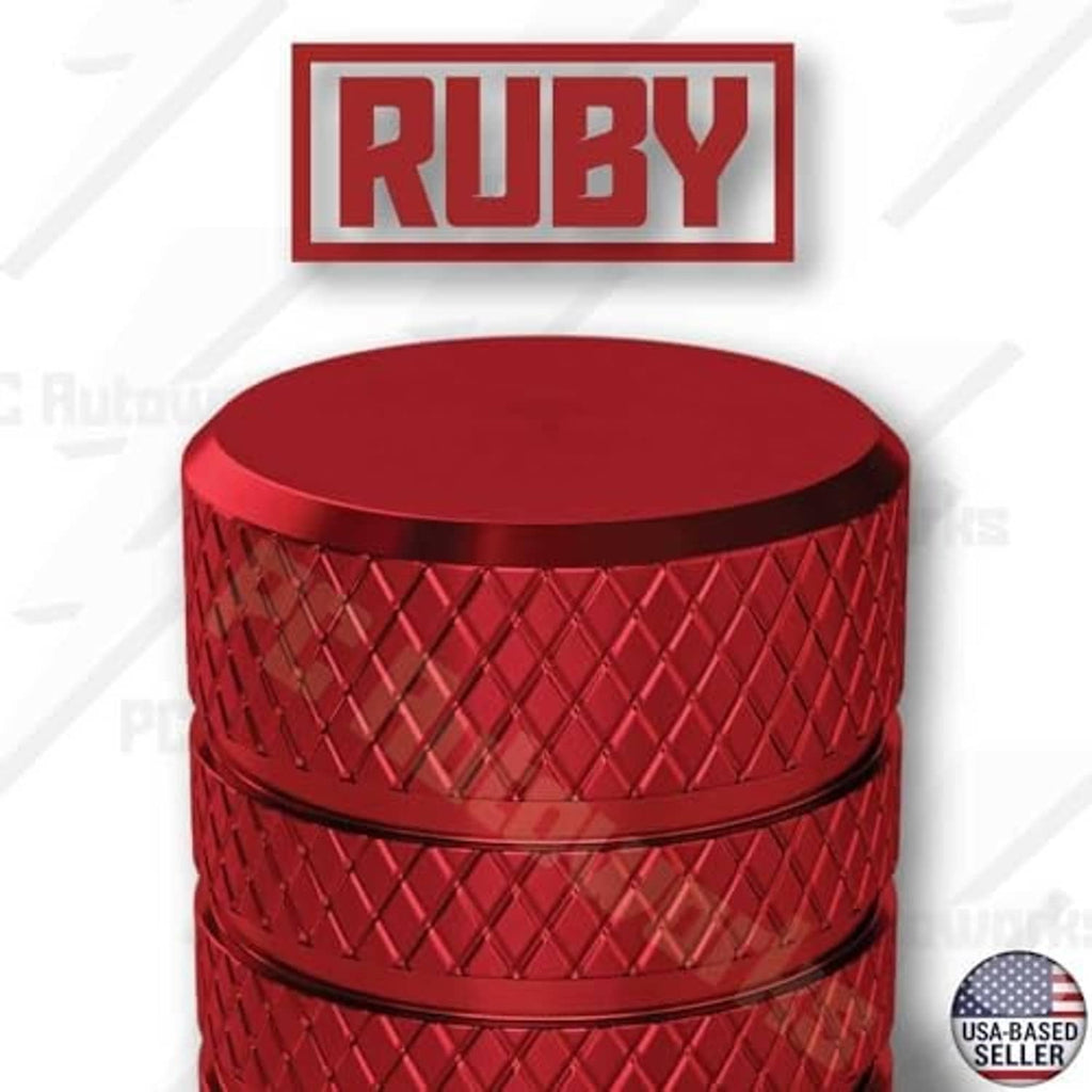Ruby red anodized aluminum tire valve stem cap, domed top with textured sides