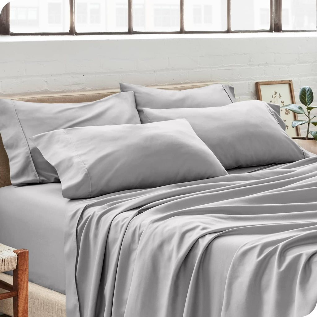 Light gray microfiber pillowcases on a bed with stitched envelope closure