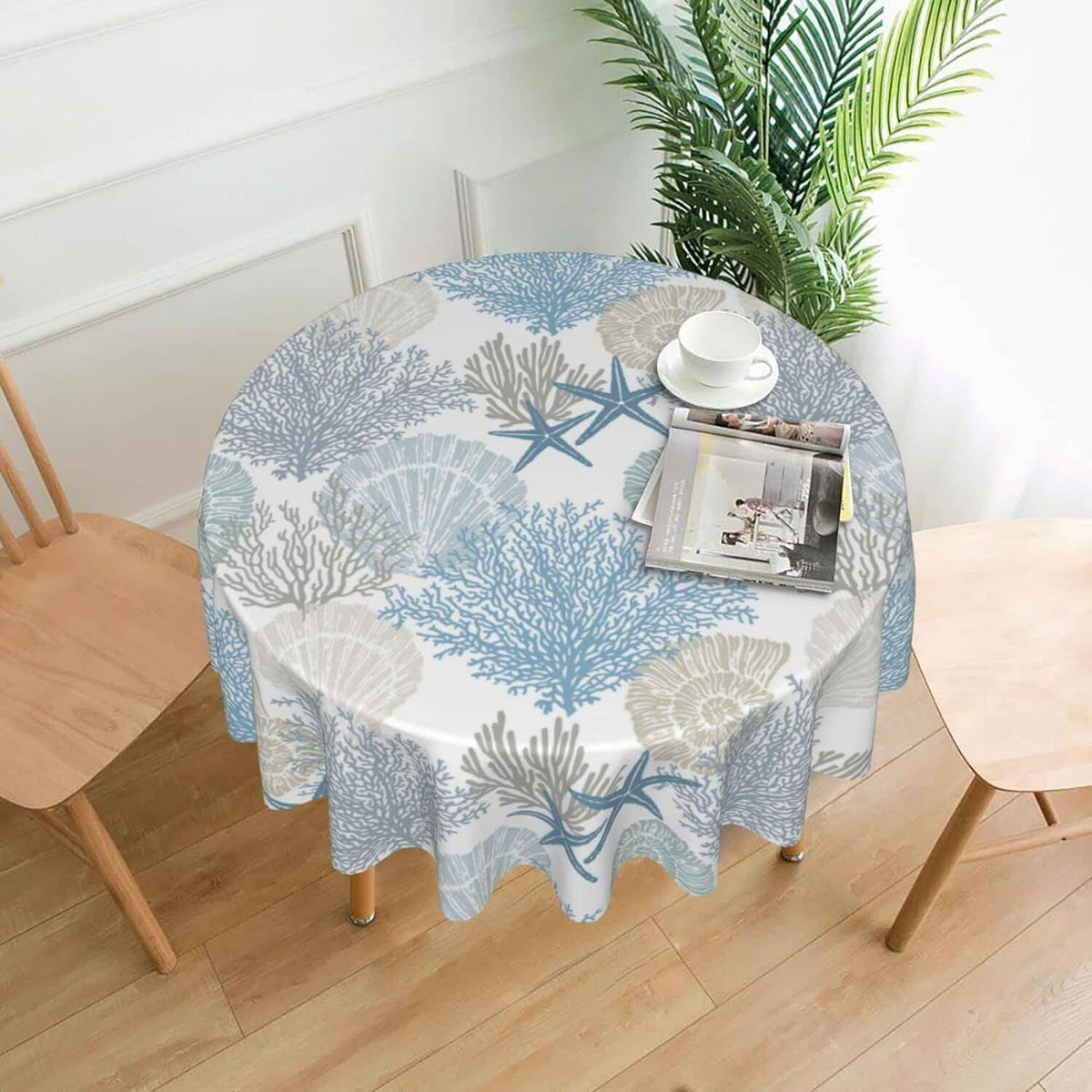 70-inch round seaside tablecloth with blue coral and starfish pattern over table