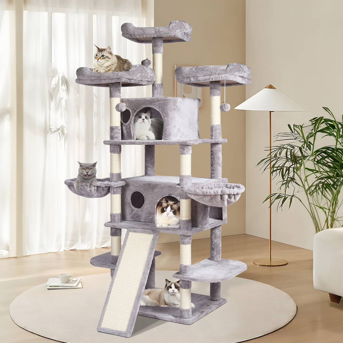 Light gray multi-level cat tree with plush condos and stacked platforms in a room