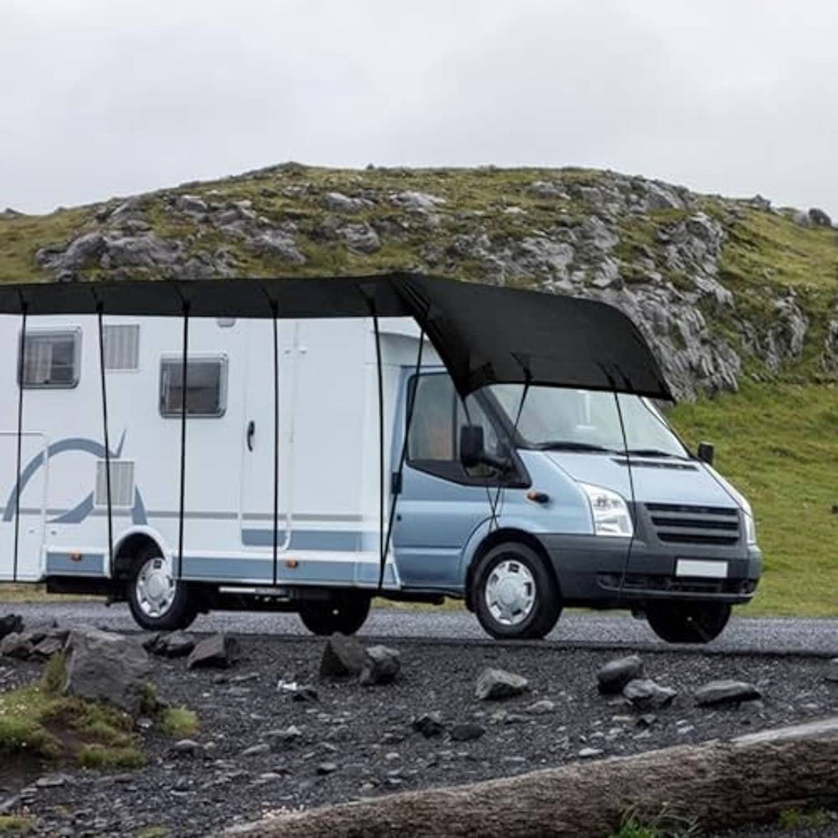 Black Oxford camper cover over full motorhome roof and sides, secured