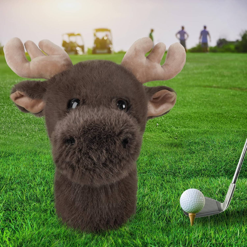 Brown moose plush golf driver headcover beside a golf ball and club