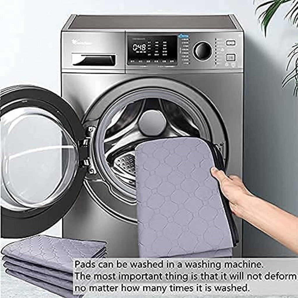 Washable guinea pig cage liner pad being loaded into a washing machine, hex-pattern surface