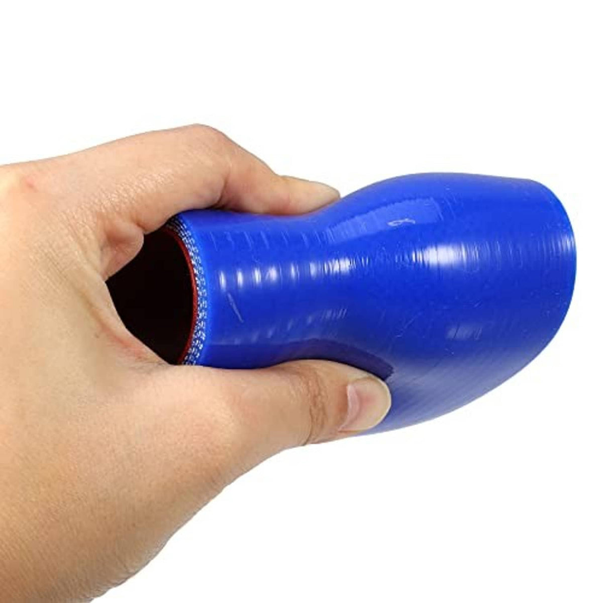 Blue silicone reducer hose coupler gripped at open end, red inner opening