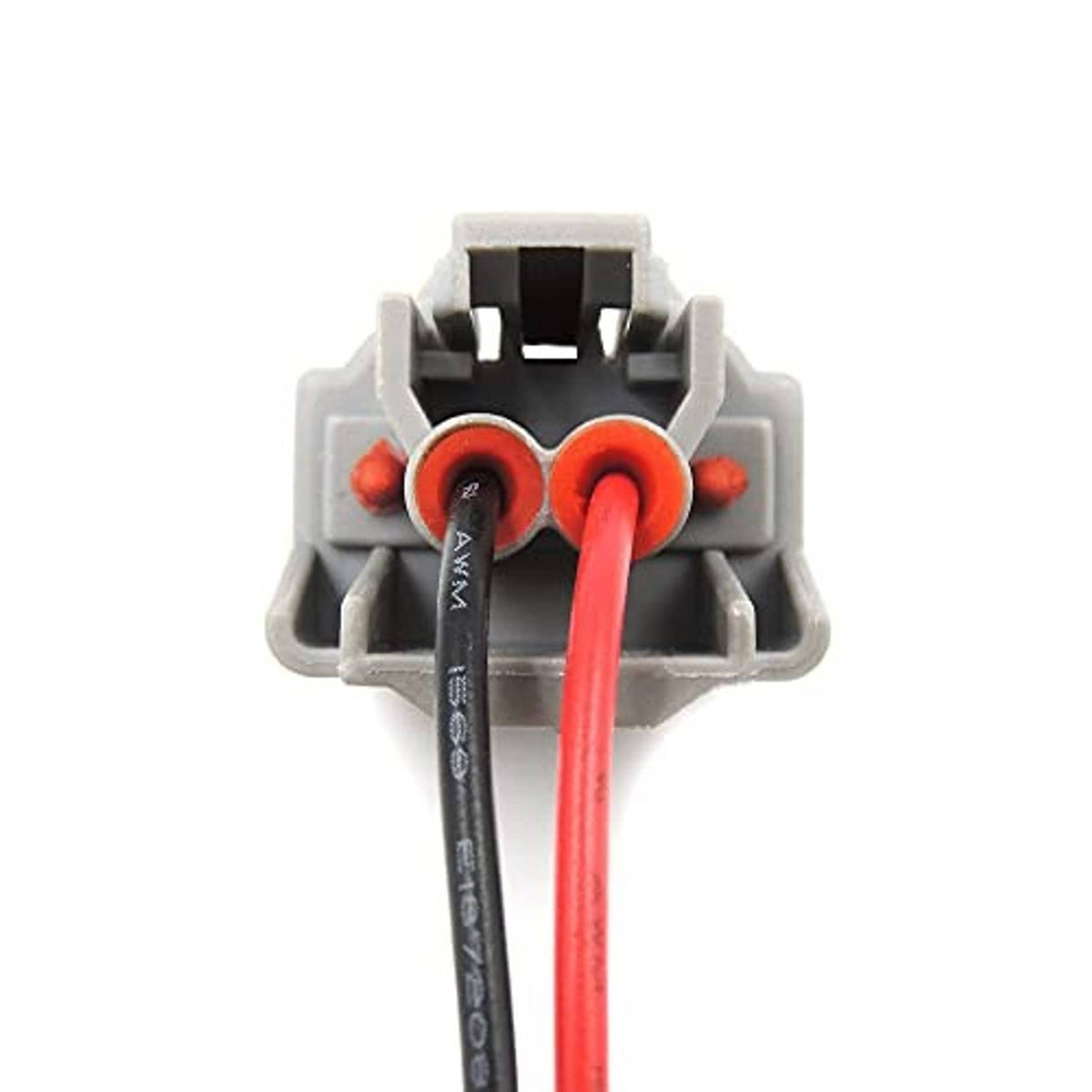 Close-up of fuel injector connector terminals with red wire and black wire