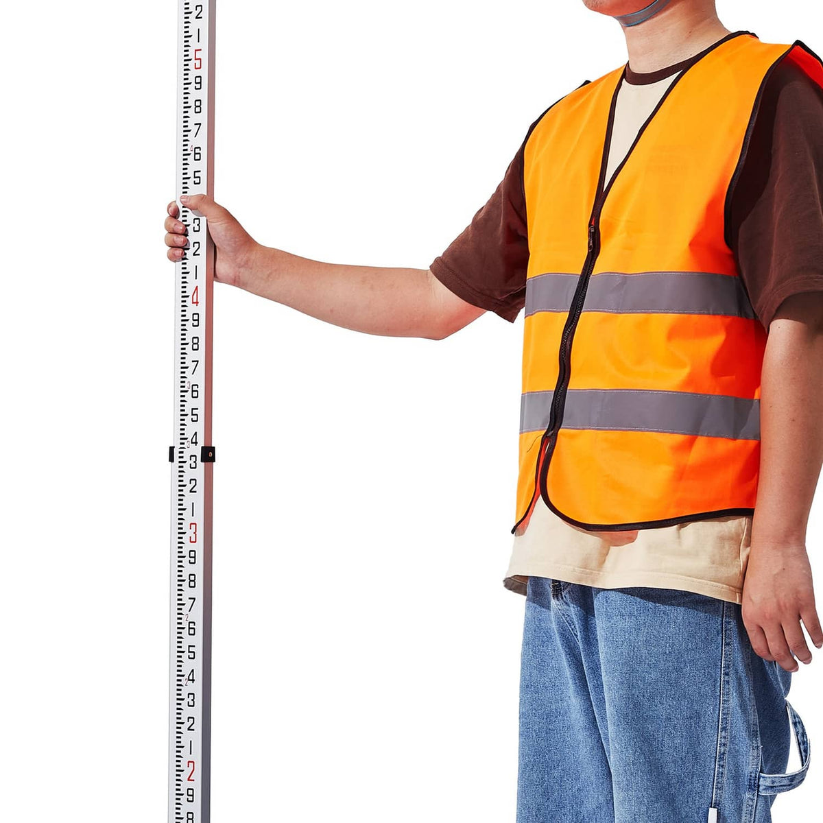 Telescopic measuring rod in use, held vertically with 10ths-inch markings