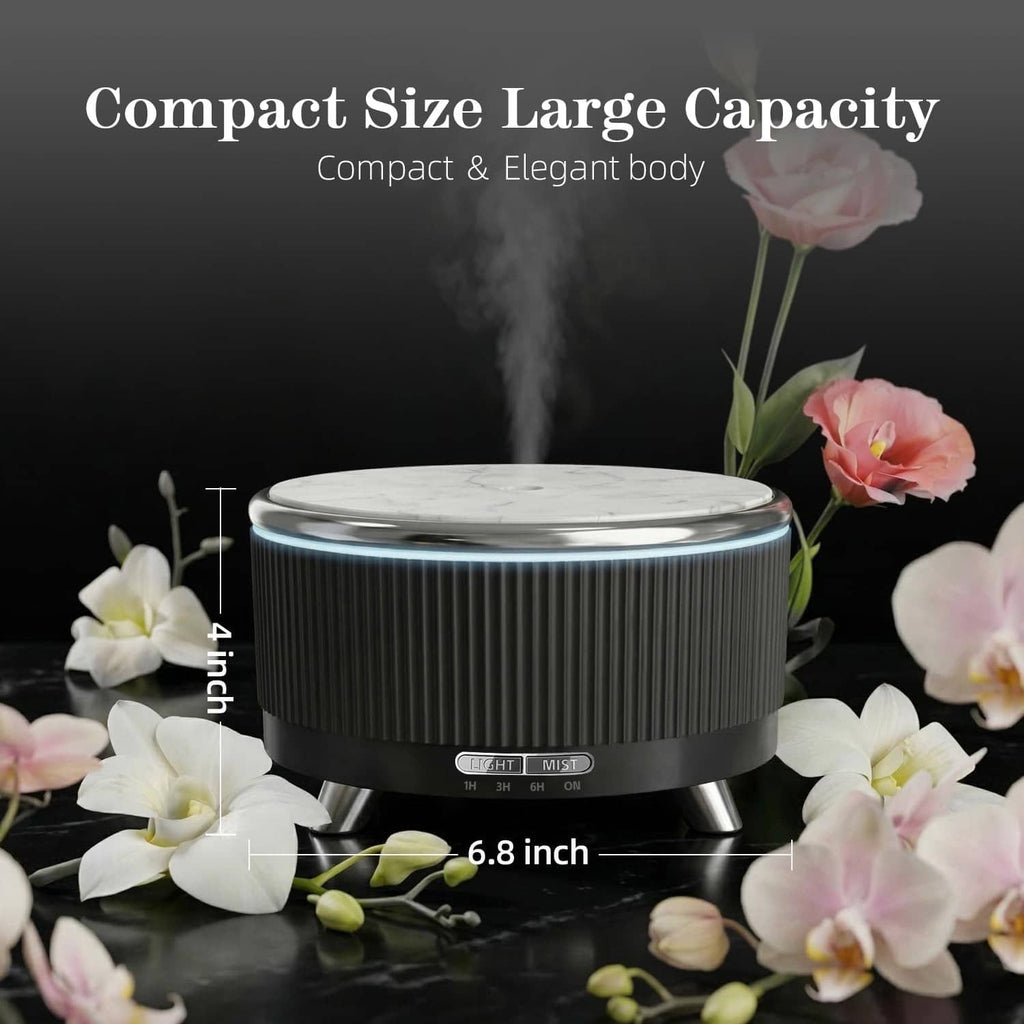 Black ultrasonic essential oil diffuser emitting mist with round top and three legs