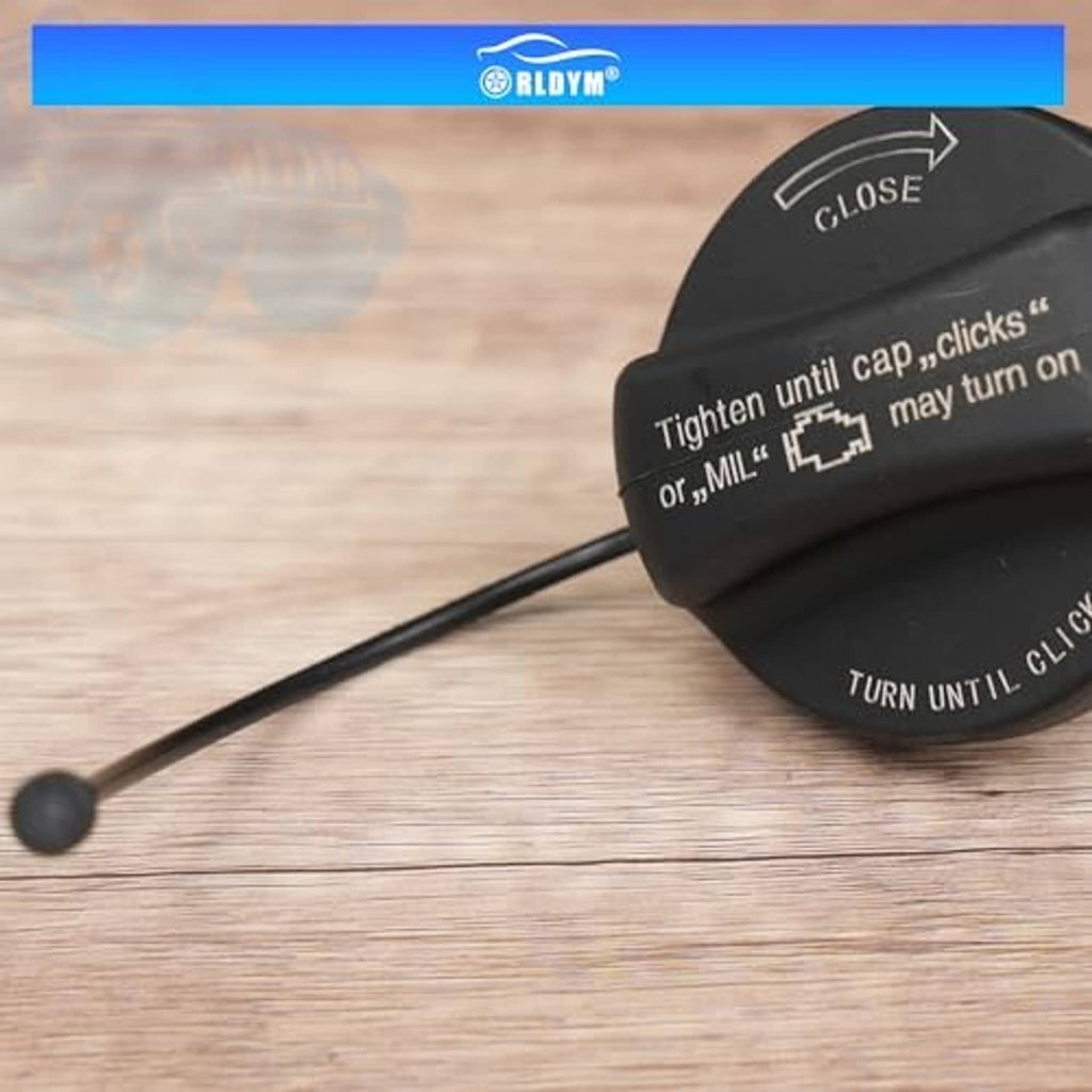 Black fuel tank filler cap close-up with tethered handle and CLOSE/TURN UNTIL CLICK text