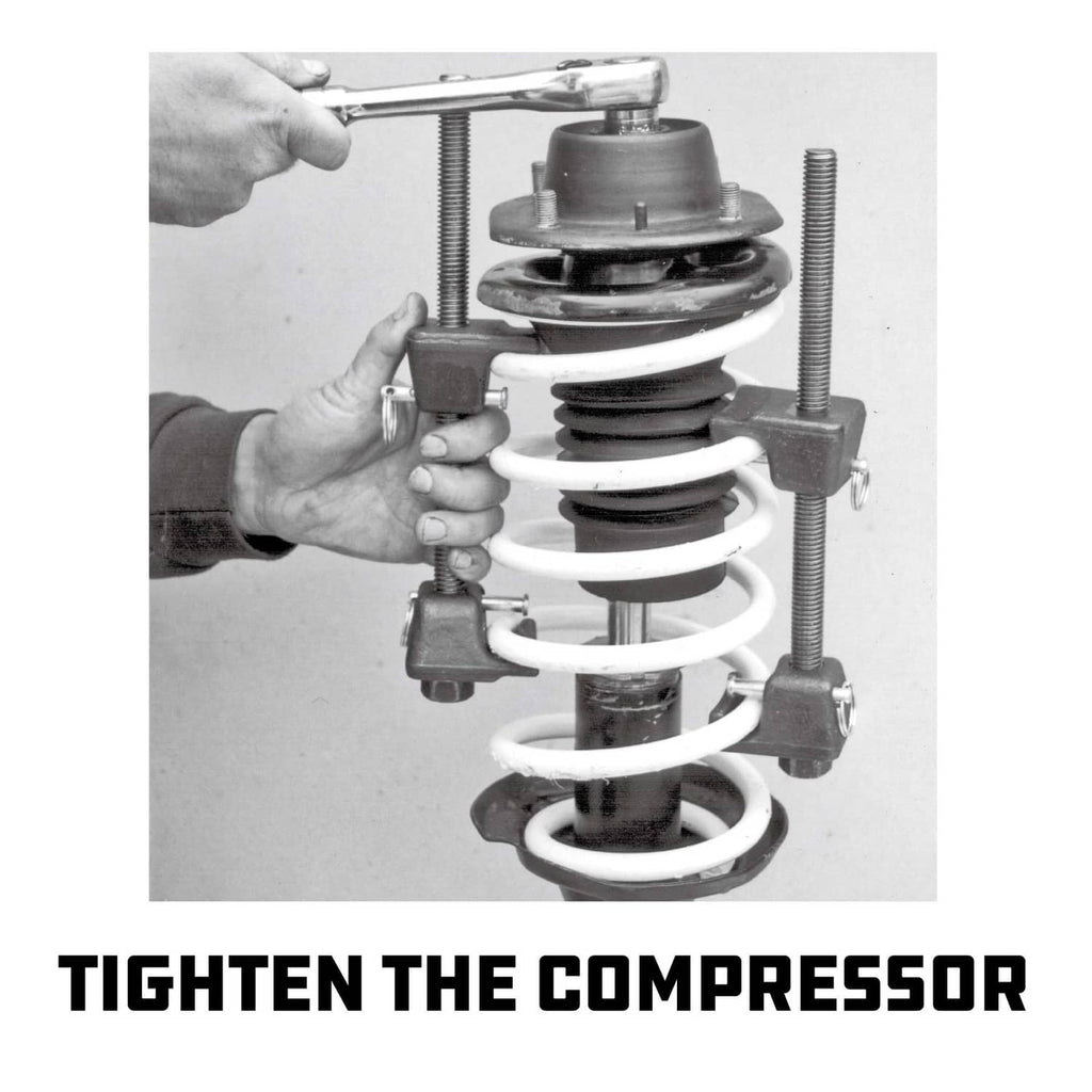 Strut spring compressor kit tightening on a coil spring with threaded adjustment rods