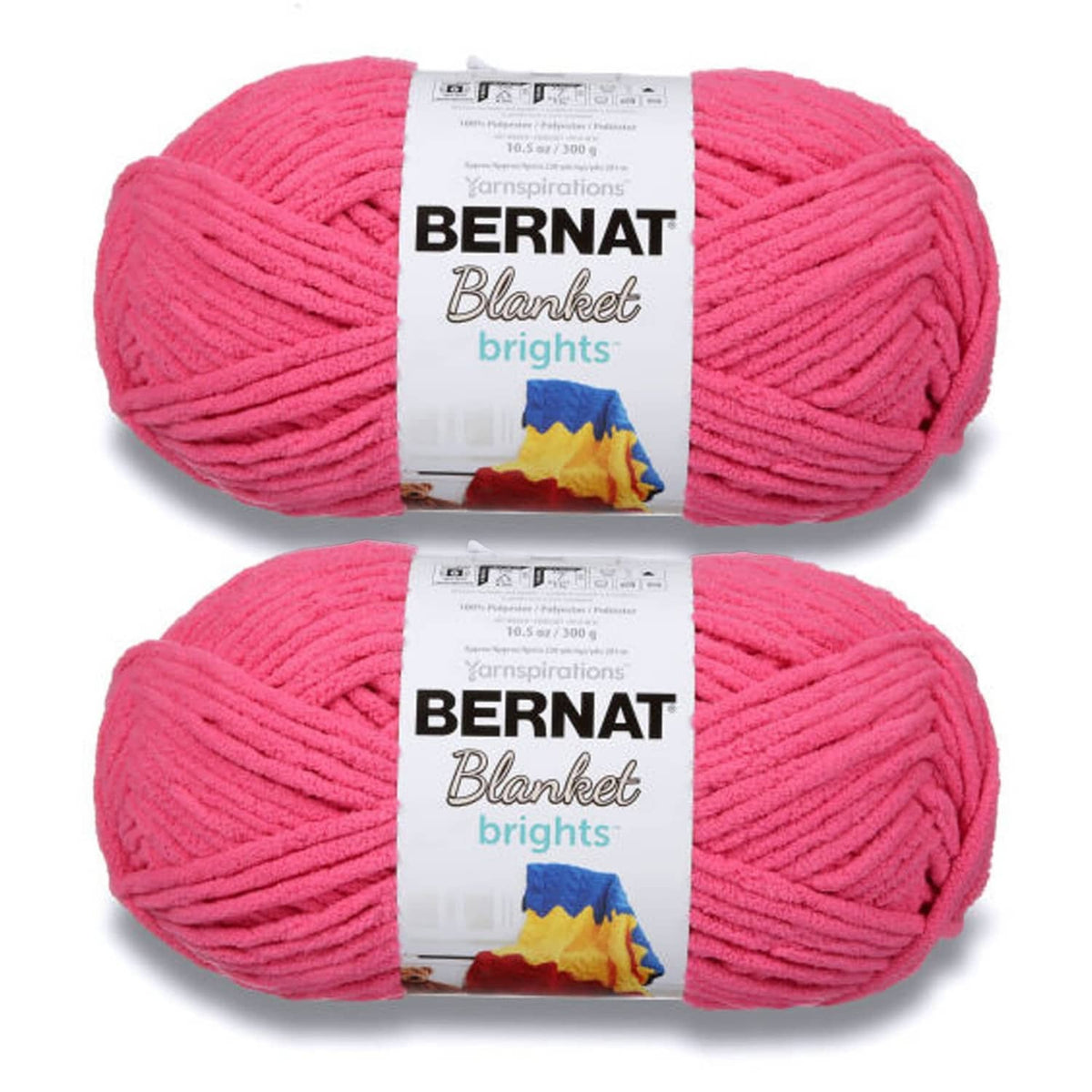 Two skeins of bright pink super-bulky yarn with Bernat Blanket brights labels