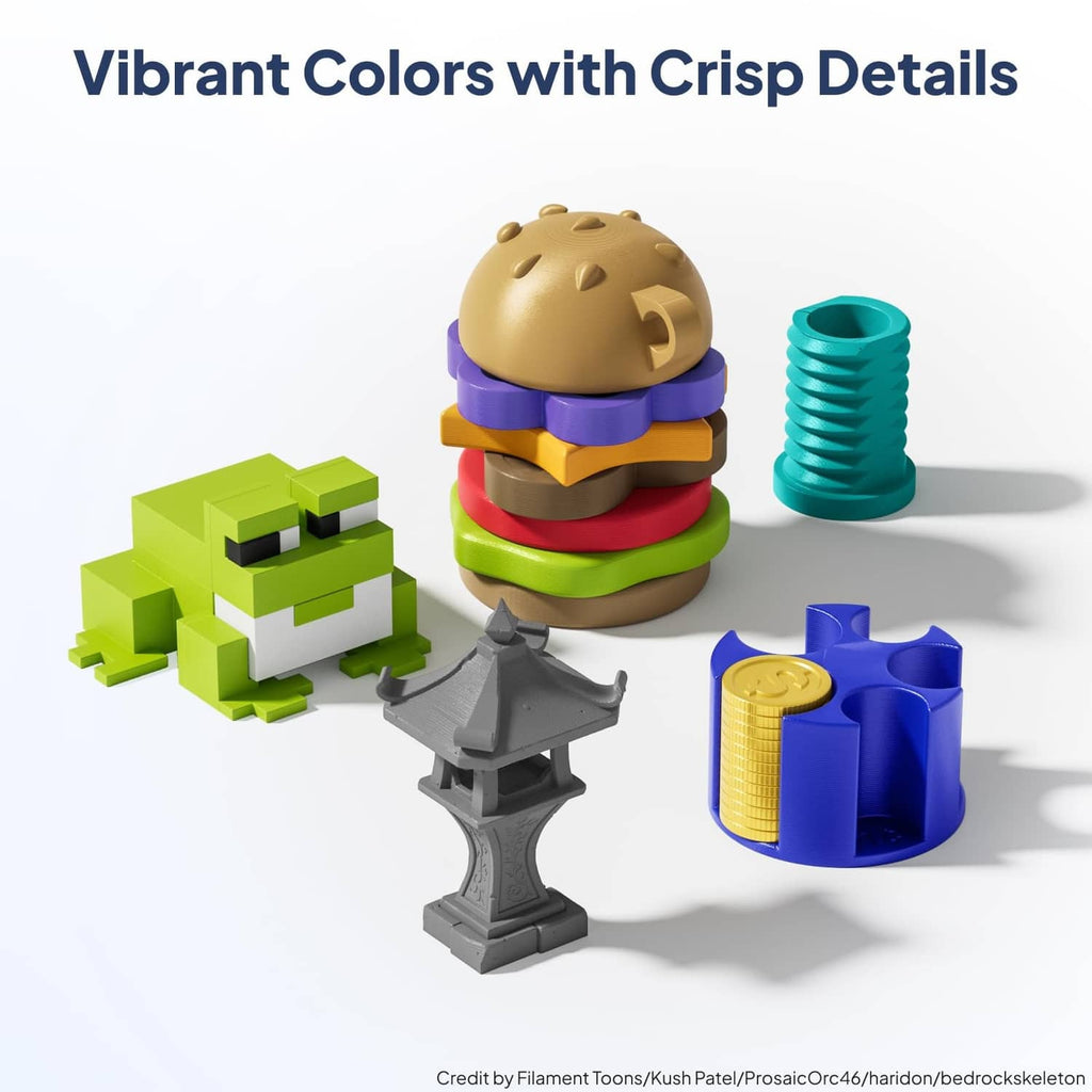 Colorful PLA+ filament spools in green, teal, purple, yellow, and blue with small parts