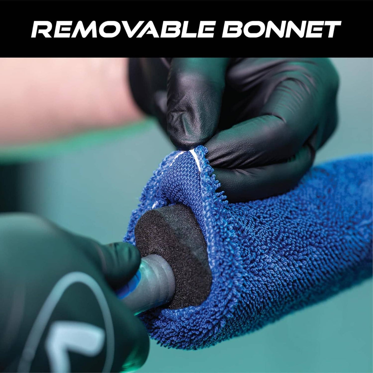 Blue microfiber wheel brush being adjusted on a removable car hood area