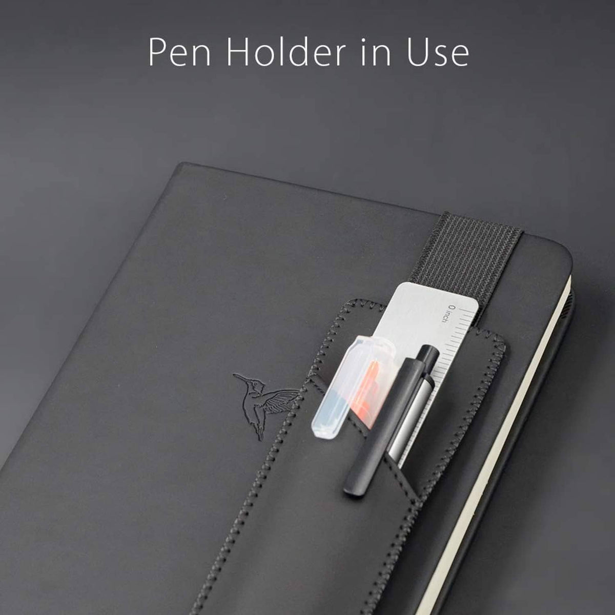 Black adjustable elastic pen holder sleeve holding a pen in the front pocket.