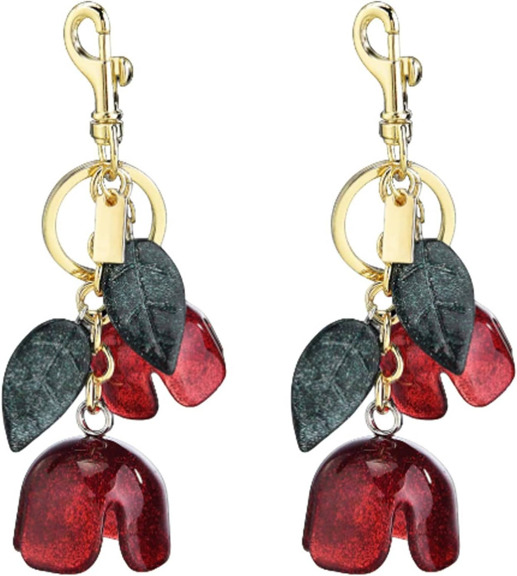 2-pack flower zipper pull charms with gold clasp and dark green/red petal dangles