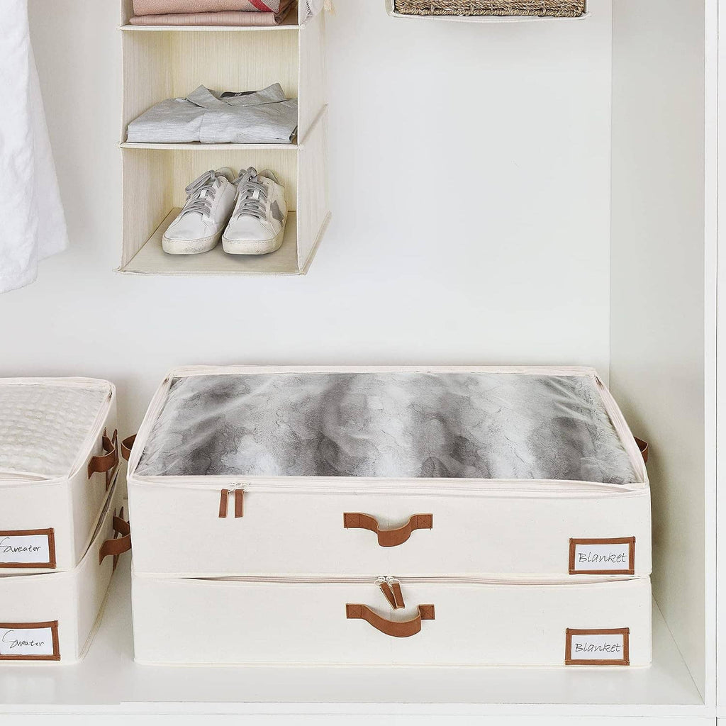 Two under-bed storage bins with label windows, white fabric boxes on closet shelf