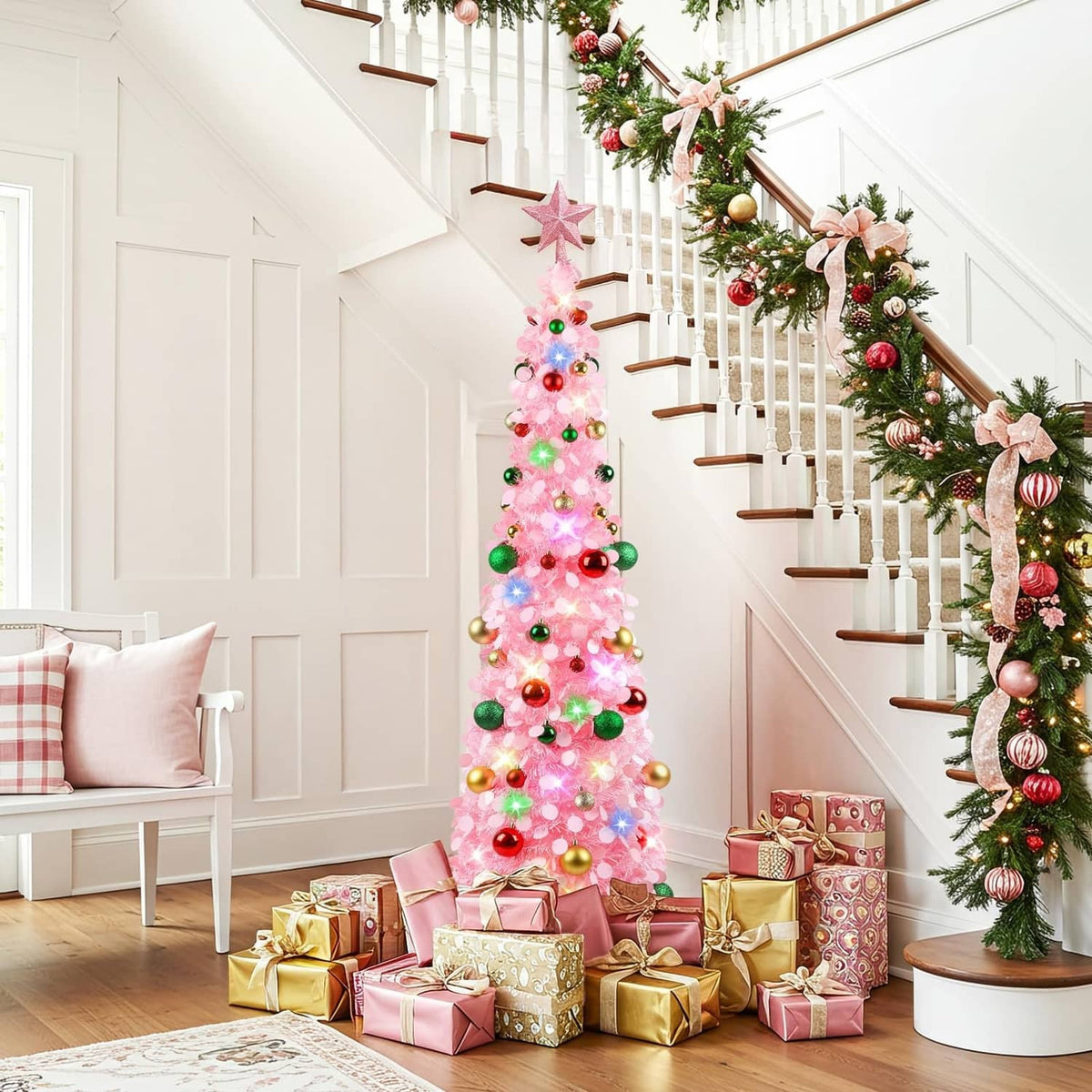 Pink lit Christmas tree with star topper and colorful ornaments beside wrapped gifts