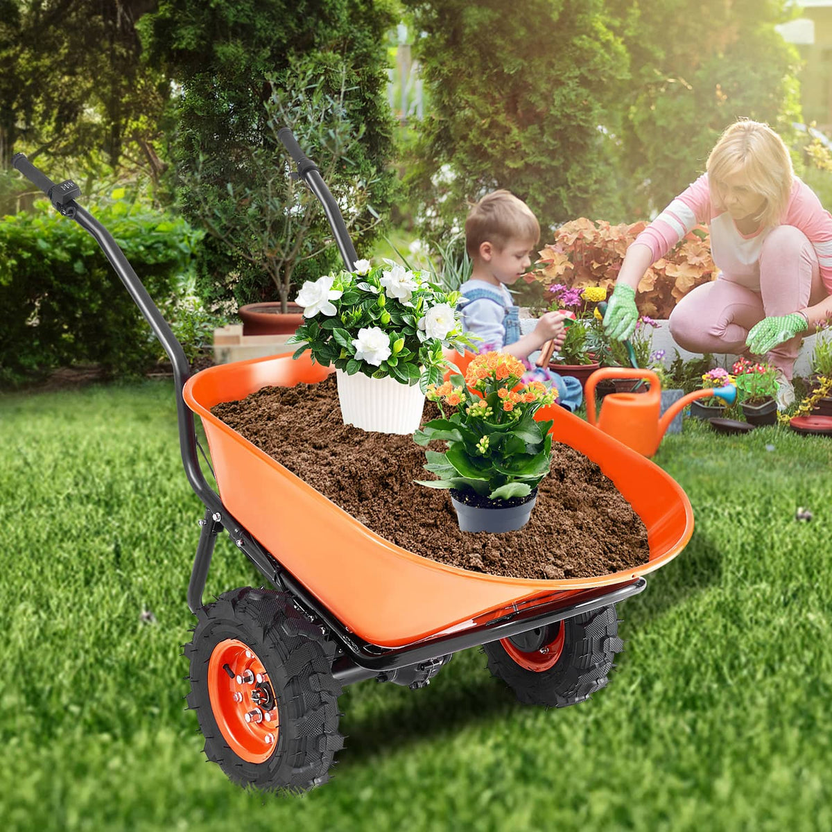 Orange electric wheelbarrow cart carrying potted flowers on a lawn