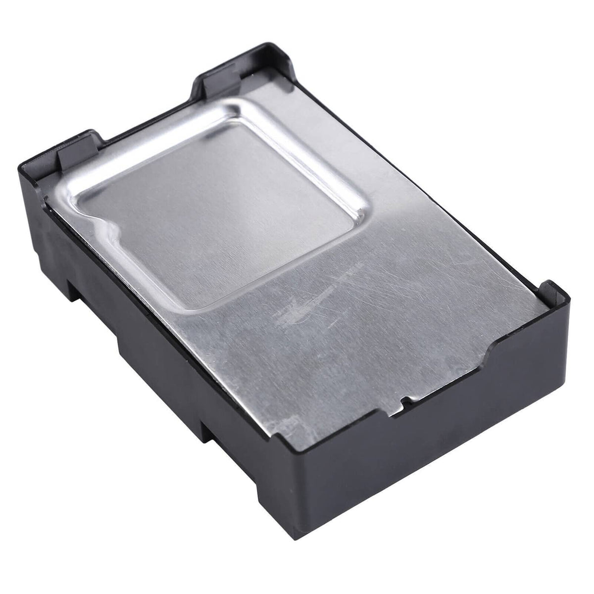 Transfer case control module with metal top plate and black plastic sides, angled view