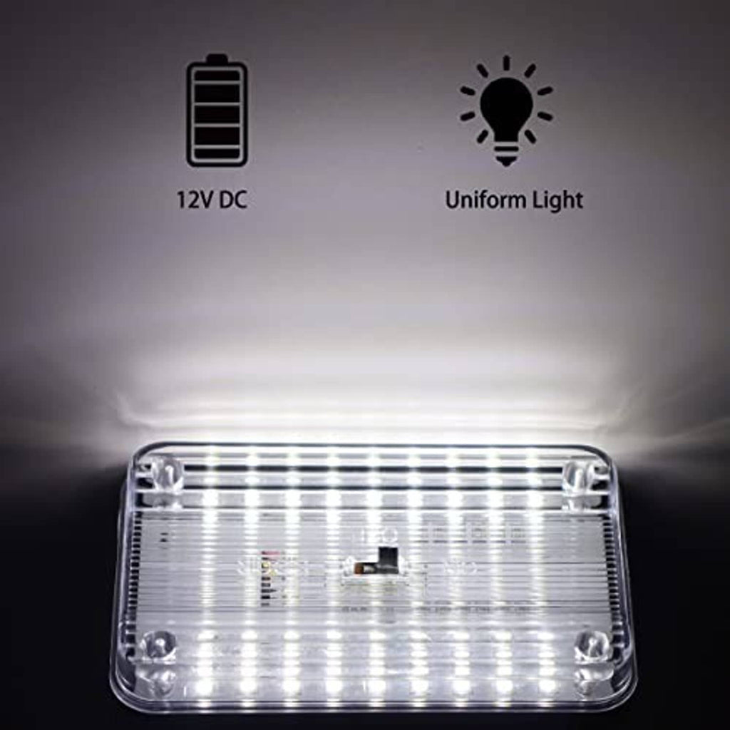 12V dome LED light shown glowing bright white through clear lens.