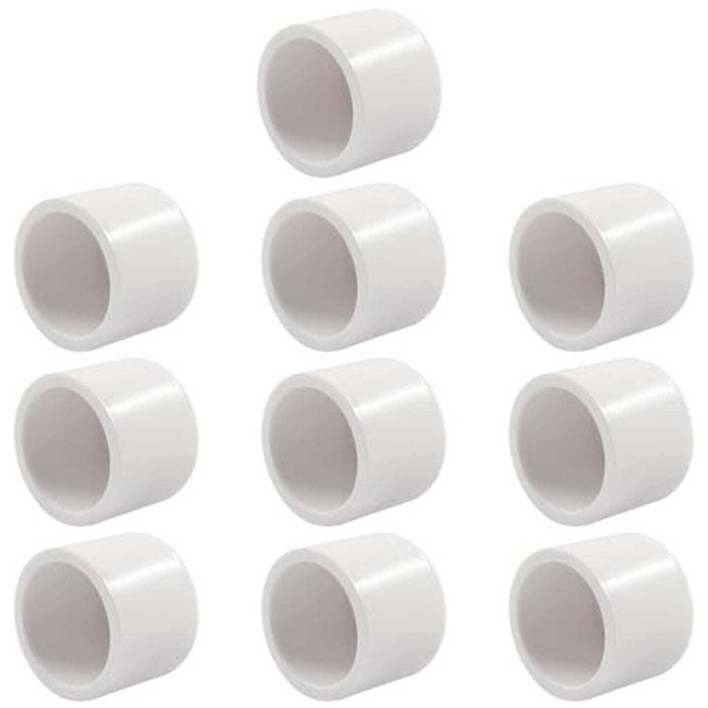 Multiple white PVC pipe end caps, open ends facing forward