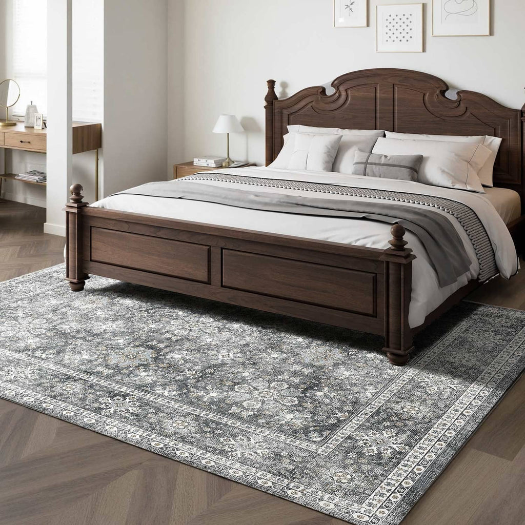 Gray vintage area rug with distressed medallion pattern and ornate border trim