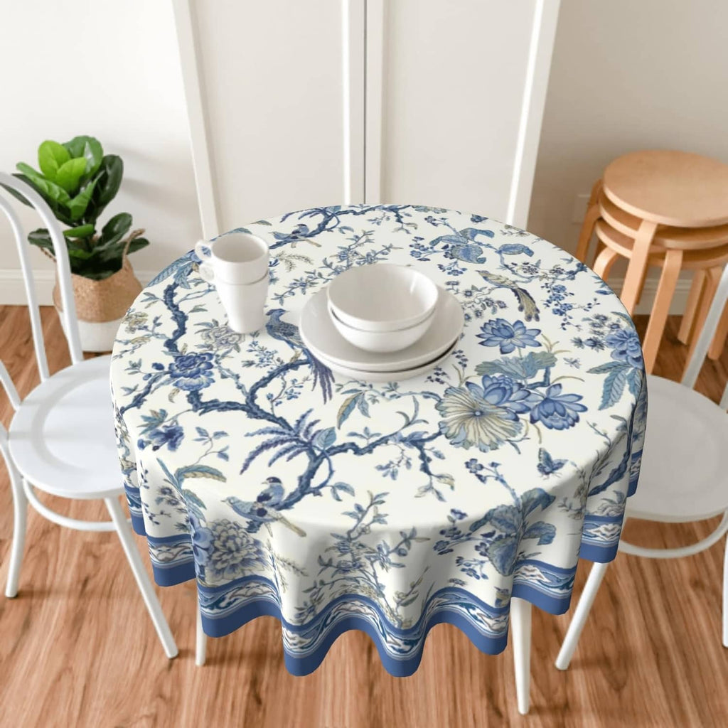 Round blue-and-white chinoiserie tablecloth with floral bird print and wave hem